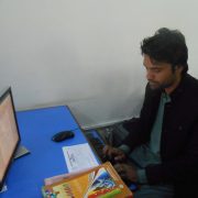 A student Busy on Computer