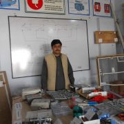 Teacher Giving Instruction to students about the tools