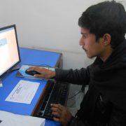 student doing his work on computer